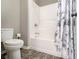 Bathroom boasting a white bathtub and shower combination with a decorative shower curtain at 1580 Johnson Nw Rd, Atlanta, GA 30318