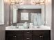 Bathroom featuring a double sink vanity with quartz counters, a large mirror, and modern lighting at 1580 Johnson Nw Rd, Atlanta, GA 30318