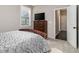 Comfortable bedroom featuring a wooden bed frame, a dresser, and a view from a window at 1580 Johnson Nw Rd, Atlanta, GA 30318