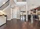Bright entryway featuring hardwood floors, staircase, and open access to the kitchen and living areas at 1580 Johnson Nw Rd, Atlanta, GA 30318