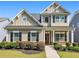 Charming two-story home with manicured landscaping and craftsman-style architecture, showing great curb appeal at 1580 Johnson Nw Rd, Atlanta, GA 30318