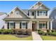 Charming two-story home with a welcoming front porch and well-manicured landscaping at 1580 Johnson Nw Rd, Atlanta, GA 30318
