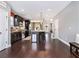 Open kitchen featuring stainless steel appliances, center island, dark wood cabinets, and hardwood floors at 1580 Johnson Nw Rd, Atlanta, GA 30318