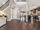 Expansive open-concept space with hardwood floors, staircase, neutral color palette and easy kitchen access at 1580 Johnson Nw Rd, Atlanta, GA 30318