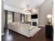 Bright living room featuring a vaulted ceiling, fireplace, hardwood floors and large sectional sofa at 1580 Johnson Nw Rd, Atlanta, GA 30318