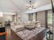 Spacious living room with vaulted ceiling, plush seating, and hardwood floors throughout the open floorplan at 1580 Johnson Nw Rd, Atlanta, GA 30318