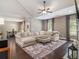Bright living room with high ceilings, a cozy couch, and an adjacent dining area at 1580 Johnson Nw Rd, Atlanta, GA 30318