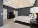 Spacious main bedroom features a decorative chandelier, neutral walls, and soft carpeting at 1580 Johnson Nw Rd, Atlanta, GA 30318