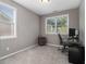 This home office offers natural light with a functional workspace and neutral walls for comfort at 1580 Johnson Nw Rd, Atlanta, GA 30318