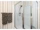 Bathroom featuring a glass enclosed shower and floral towels hanging on the towel rack at 211 Colonial Homes Nw Dr # 2203, Atlanta, GA 30309