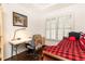 Bedroom with hardwood floors, desk, twin bed, and natural light from the window at 211 Colonial Homes Nw Dr # 2203, Atlanta, GA 30309