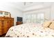 Bright bedroom with white shutters, hardwood floors, and lots of light at 211 Colonial Homes Nw Dr # 2203, Atlanta, GA 30309