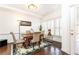 Bright dining room features hardwood floors, crown molding, and natural light at 211 Colonial Homes Nw Dr # 2203, Atlanta, GA 30309