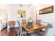Bright dining room features hardwood floors, crown molding, and pass-through view to the kitchen at 211 Colonial Homes Nw Dr # 2203, Atlanta, GA 30309