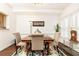 Bright dining room features hardwood floors, crown molding, and natural light at 211 Colonial Homes Nw Dr # 2203, Atlanta, GA 30309