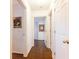 Neutral hallway with hardwood flooring leads to multiple rooms at 211 Colonial Homes Nw Dr # 2203, Atlanta, GA 30309