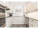 Modern kitchen featuring stainless steel appliances, granite countertops, and white cabinets at 211 Colonial Homes Nw Dr # 2203, Atlanta, GA 30309