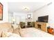 Comfortable living area featuring a fireplace, plush seating, and bright natural light at 211 Colonial Homes Nw Dr # 2203, Atlanta, GA 30309