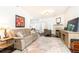 Comfortable living area featuring a fireplace, plush seating, and bright natural light at 211 Colonial Homes Nw Dr # 2203, Atlanta, GA 30309