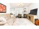 Comfortable living area featuring a fireplace, plush seating, and bright natural light at 211 Colonial Homes Nw Dr # 2203, Atlanta, GA 30309
