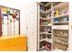 Spacious walk-in pantry with custom shelving and organization systems at 211 Colonial Homes Nw Dr # 2203, Atlanta, GA 30309