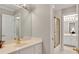 Bathroom featuring white vanity, gold fixtures, and a glass-enclosed shower at 2250 Edgemere Lake Cir, Marietta, GA 30062