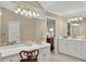Bright main bathroom features lots of counter space, and a decorative lighting fixture over an expansive mirror at 2250 Edgemere Lake Cir, Marietta, GA 30062