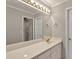 Bathroom featuring a white vanity with gold fixtures and large mirror at 2250 Edgemere Lake Cir, Marietta, GA 30062