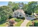 Stately two-story home with a lush front yard, elegant landscaping, and a circular driveway at 2250 Edgemere Lake Cir, Marietta, GA 30062