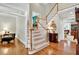 Welcoming foyer with hardwood floors, staircase, and views into the adjacent living spaces at 2250 Edgemere Lake Cir, Marietta, GA 30062