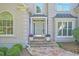 Inviting front entrance with a stone walkway and a charming light blue front door at 2250 Edgemere Lake Cir, Marietta, GA 30062