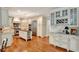 Spacious kitchen with custom cabinets, stainless steel appliances, and hardwood floors at 2250 Edgemere Lake Cir, Marietta, GA 30062