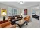 Well-appointed living room with leather seating, shuttered windows, and views to the office at 2250 Edgemere Lake Cir, Marietta, GA 30062