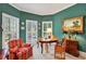 Cozy living room with many windows, complemented by a round table, and natural light at 2250 Edgemere Lake Cir, Marietta, GA 30062