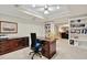 Well-lit home office with built-in shelving and rich wood desk space at 2250 Edgemere Lake Cir, Marietta, GA 30062