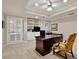 Bright office space featuring custom built-ins, desk, and French doors leading to the outside at 2250 Edgemere Lake Cir, Marietta, GA 30062