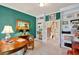 Comfortable home office featuring built-in bookshelves and storage, bright light, and decorative wall art at 2250 Edgemere Lake Cir, Marietta, GA 30062