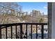 Balcony overlooking the city with a black metal railing and decorative lighting at 2255 Peachtree Ne Rd # 521, Atlanta, GA 30309