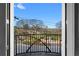 View from balcony overlooking mature trees and landscaping, framed by white door trim at 2255 Peachtree Ne Rd # 521, Atlanta, GA 30309