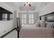 Well-lit bedroom with plantation shutters, dark wood furniture, and a neutral color palette at 2255 Peachtree Ne Rd # 521, Atlanta, GA 30309