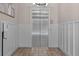 A modern elevator in a tiled lobby area with white wall paneling and modern lighting at 2255 Peachtree Ne Rd # 521, Atlanta, GA 30309