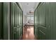 Hallway with hardwood flooring and a view into an office space and natural light at 2255 Peachtree Ne Rd # 521, Atlanta, GA 30309