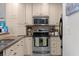 Cozy kitchen with modern stainless steel appliances and light cabinets at 2255 Peachtree Ne Rd # 521, Atlanta, GA 30309