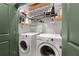 Laundry room featuring a stacked washer and dryer, and shelving with storage at 2255 Peachtree Ne Rd # 521, Atlanta, GA 30309