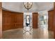 Stately lobby with curved wood paneling, tiled floors, and decorative chandelier at 2255 Peachtree Ne Rd # 521, Atlanta, GA 30309