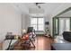 This office has hardwood flooring, a large window, and an open doorway to the living room at 2255 Peachtree Ne Rd # 521, Atlanta, GA 30309