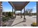 Relaxing pool area with pergola and lush landscaping under a blue sky at 2255 Peachtree Ne Rd # 521, Atlanta, GA 30309