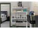 Stylish shelving unit next to the breakfast bar, creating a functional and fashionable space at 2255 Peachtree Ne Rd # 521, Atlanta, GA 30309