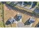 Aerial view of houses showcasing the property's location, landscaping, and neighborhood layout at 3440 Carswell Bnd, Cumming, GA 30028
