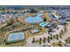 Community aerial view showcasing the pool, tennis courts, pond, and residential area at 3440 Carswell Bnd, Cumming, GA 30028